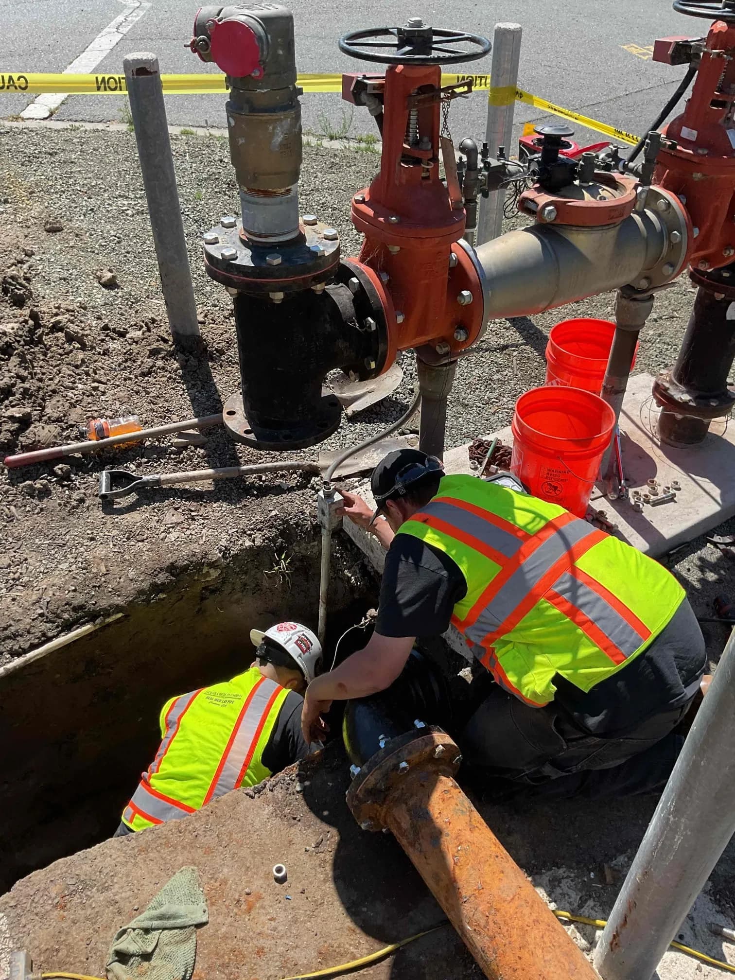 Guerra Bros. Plumbing team installing commercial backflow preventer and water main