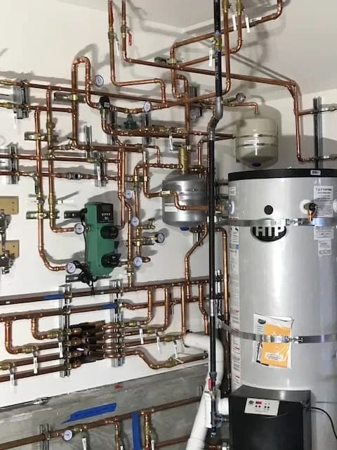HTP water heater installation with complete hydronic system — Guerra Bros. Plumbing